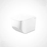 A white wall-mounted toilet with a closed lid, shown from a three-quarters angle on a light gray background.